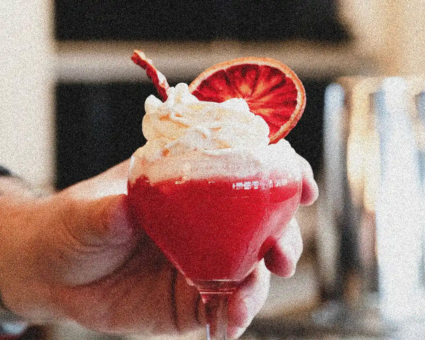 Spicy strawberry blood orange cocktail with dehydrated blood orange garnish and arbol chili