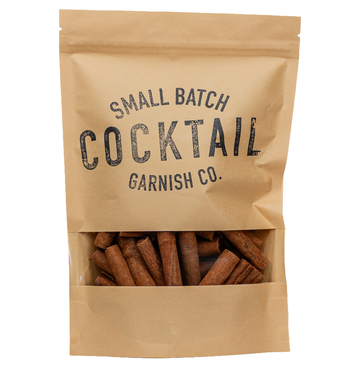 A kraft paper stand-up pouch with a clear window at the bottom showing cinnamon sticks inside. The pouch is printed with the text 'SMALL BATCH COCKTAIL GARNISH CO.
