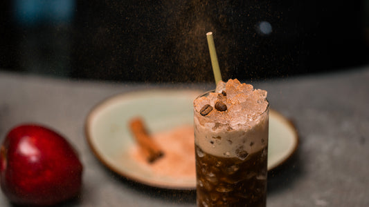 High Ball Espresso Martini on pebble ice with espresso bean garnish and cinnamon